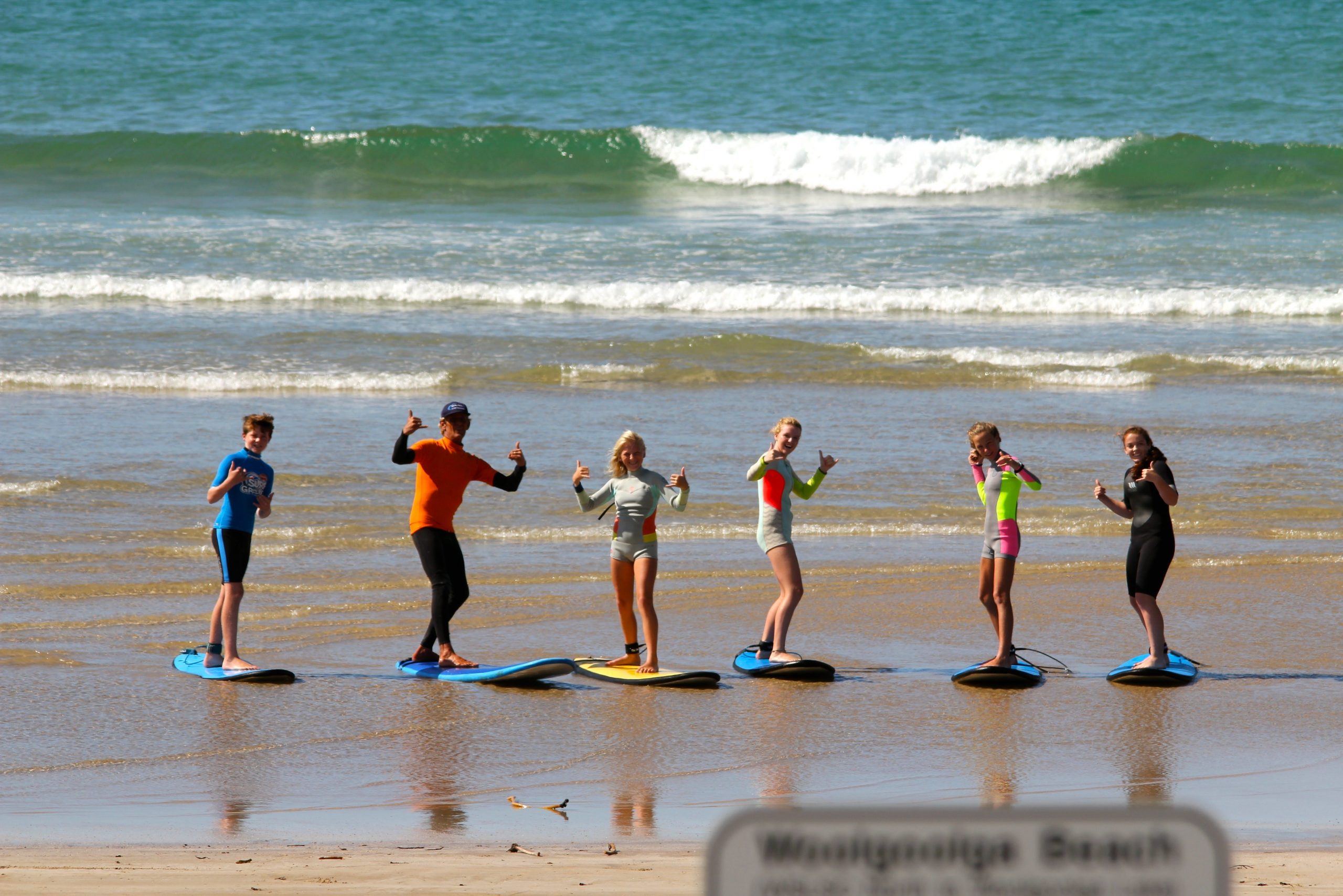 Surfing stoke at Woolgoolga Beach with our experienced coaches