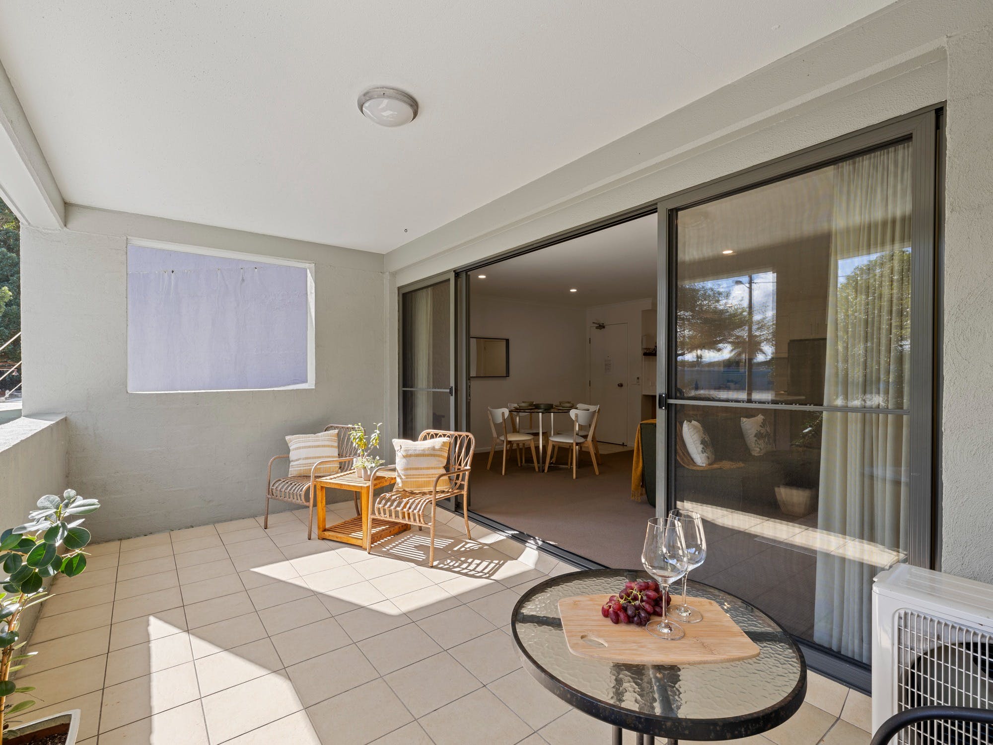 Sunny balcony with leafy outlook over the main street