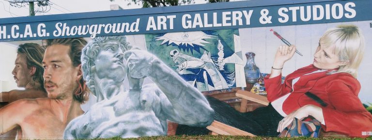 Mural on front of the building, in street-art style, showing arty features