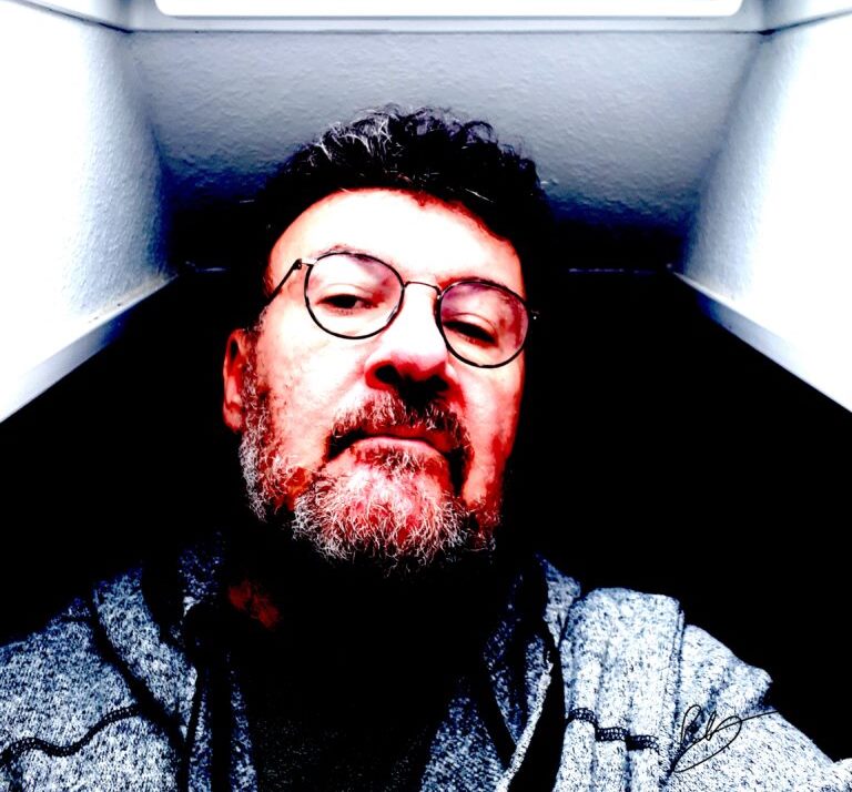 Image of Paul wearing reading glasses