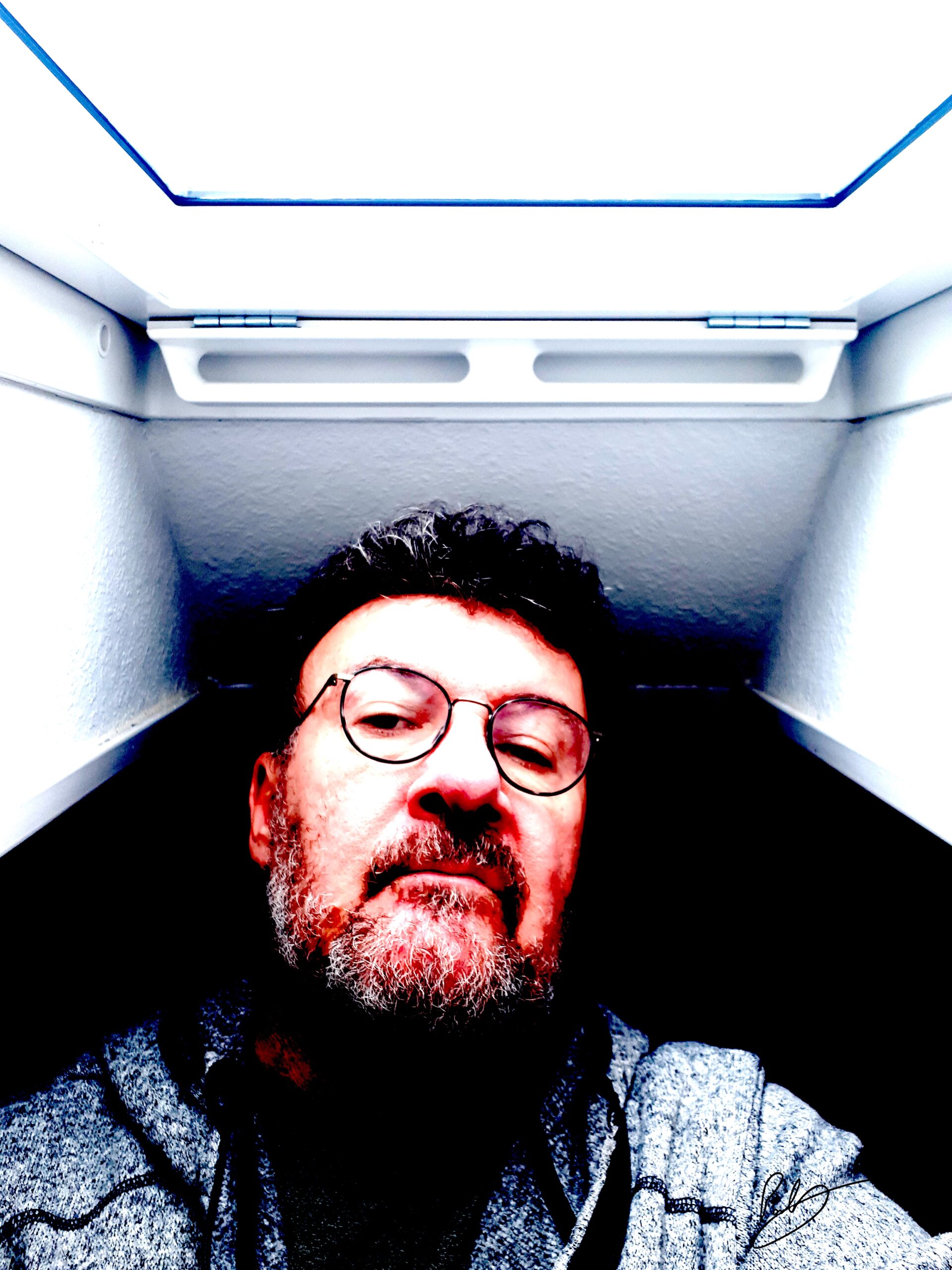 Image of Paul wearing reading glasses