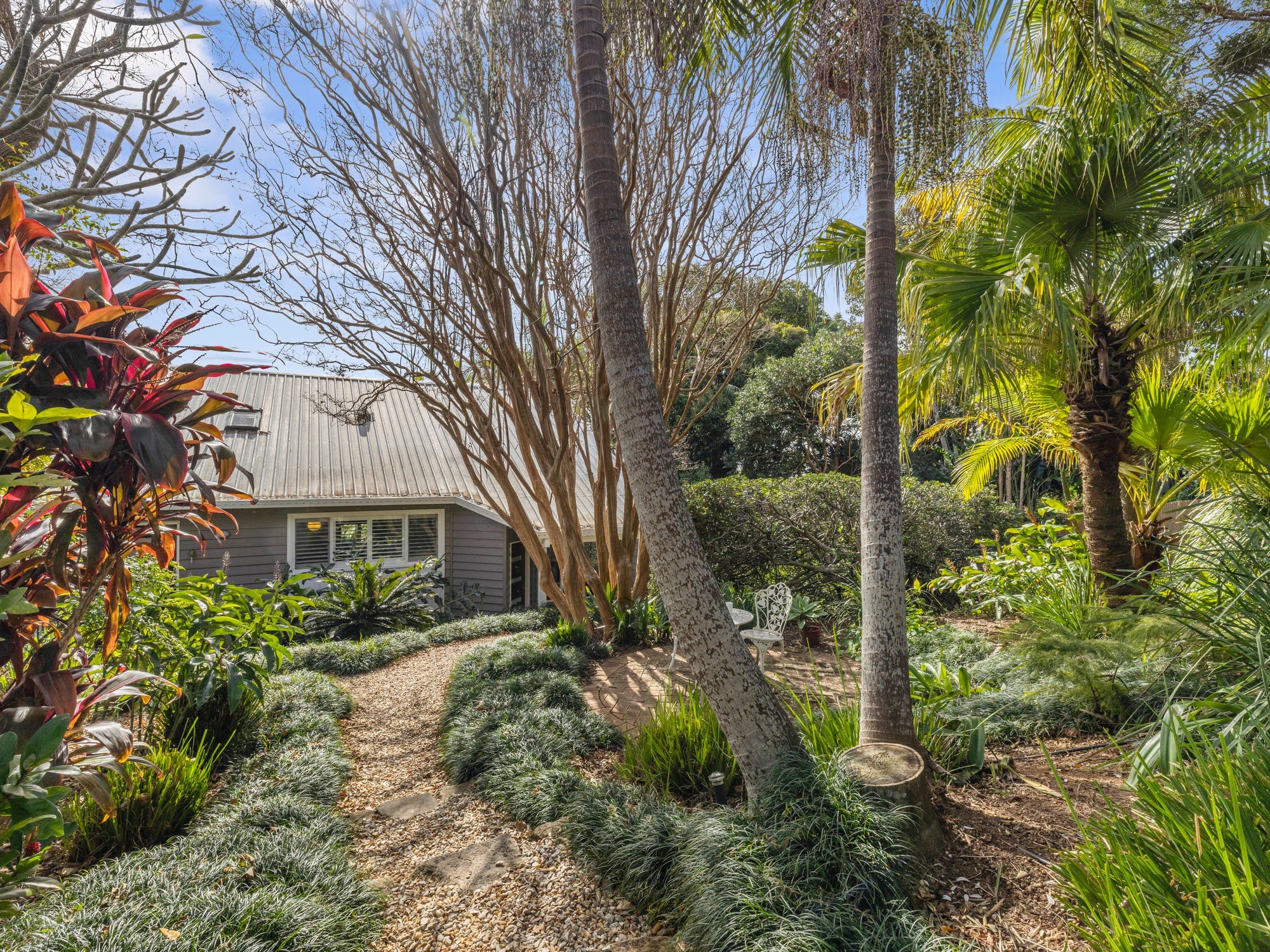 Front gardens and path leading toward the property entrance