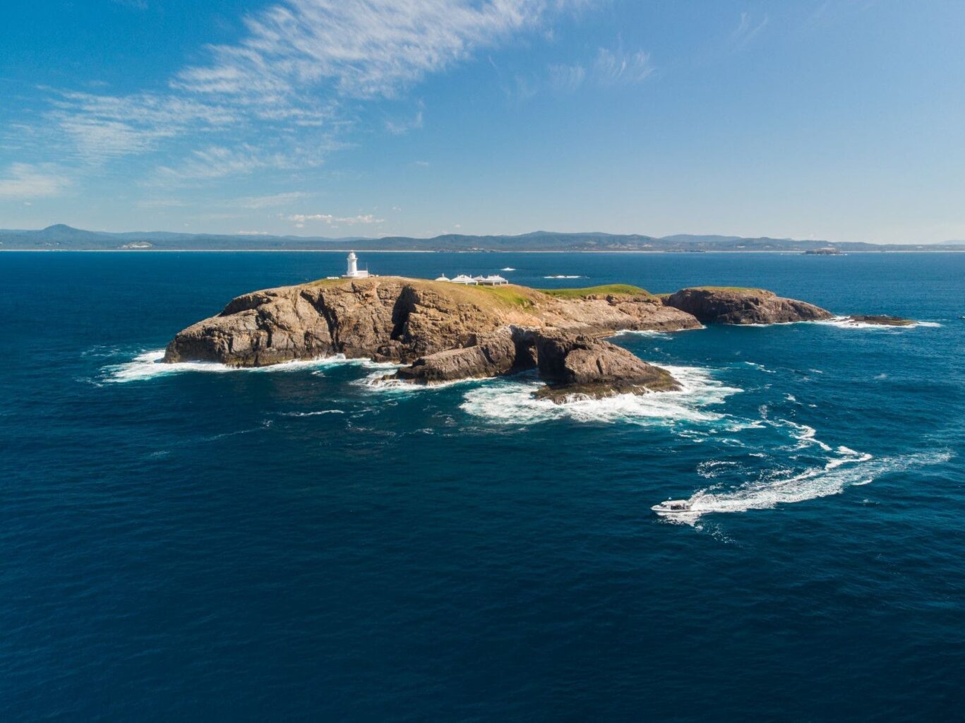 South Solitary Island aerial image showing lighthouse and archies cave