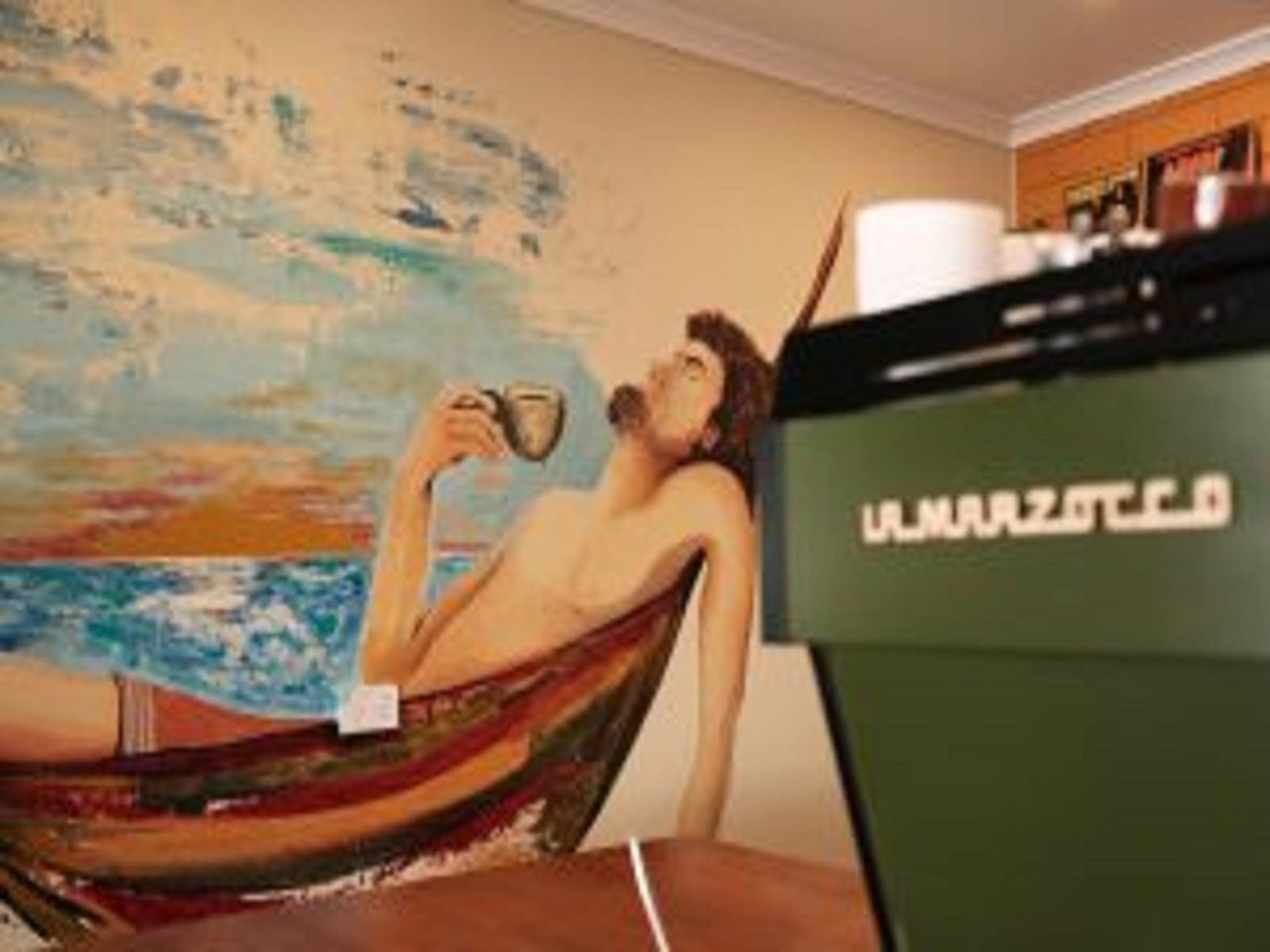 Coffee machine and art work on wall