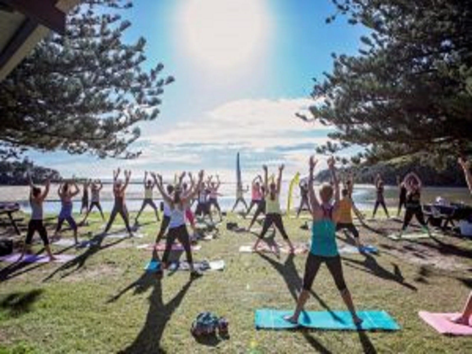 outdoor group exercise class in form of the ocean