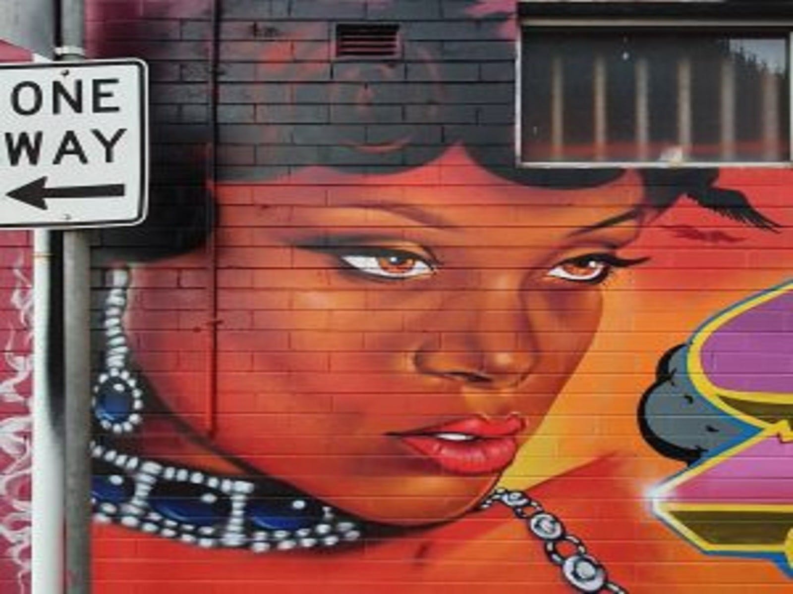 Girl artwork on brick wall