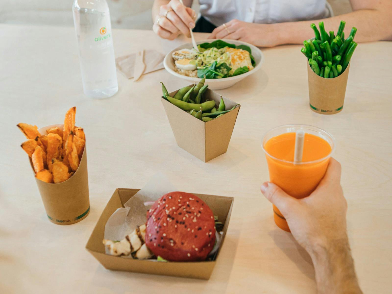 Oliver's meals - burger, sweet potato chips, steamed green beans, nourish bowl and fresh juice