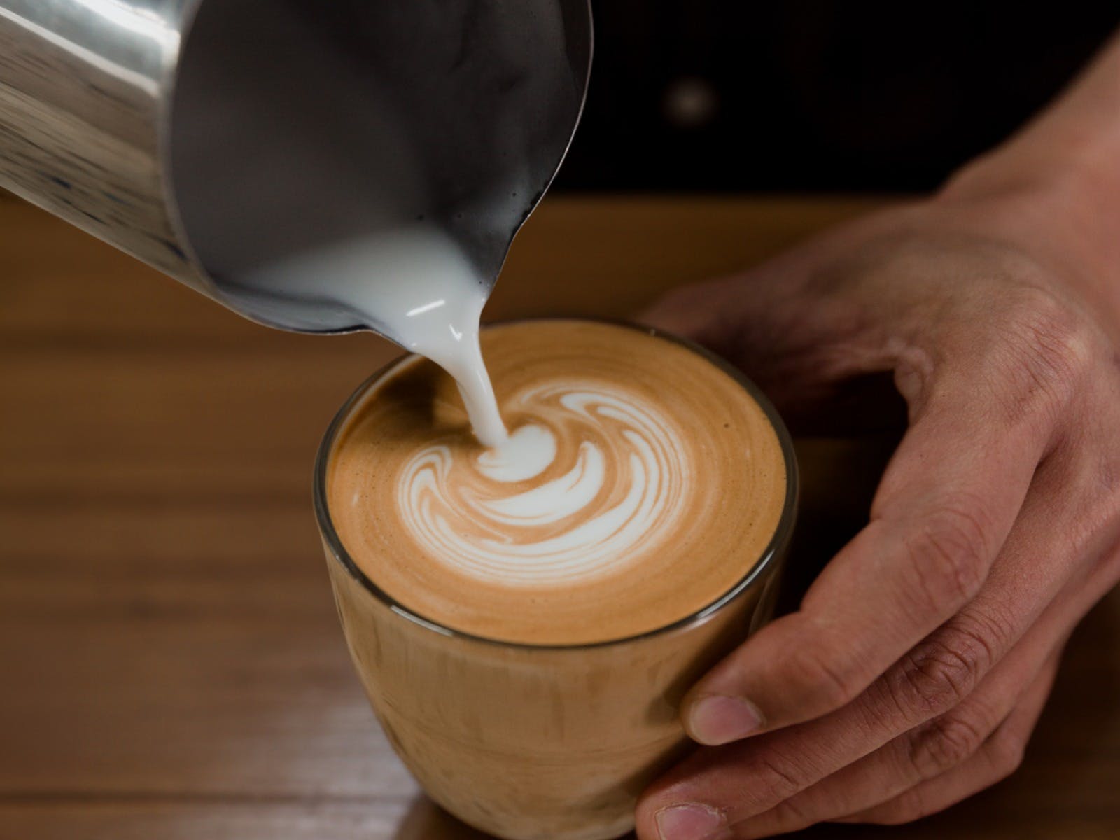Oliver's specialty coffee being poured by our expert barista