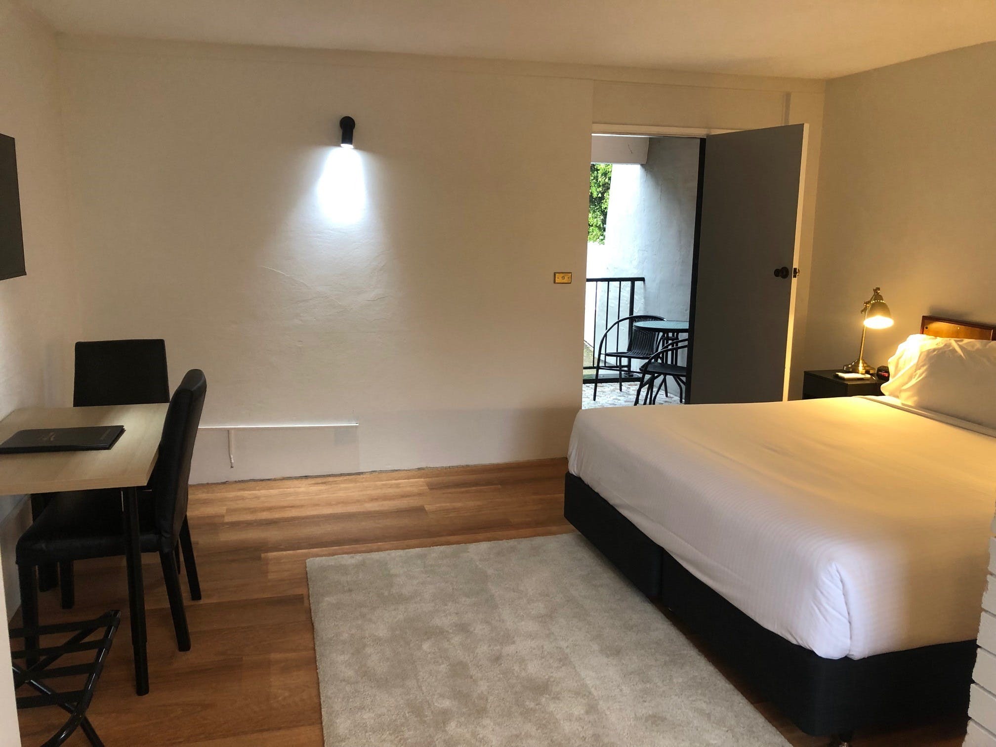 Business Suite with kitchenette, lounge, desk, and balcony