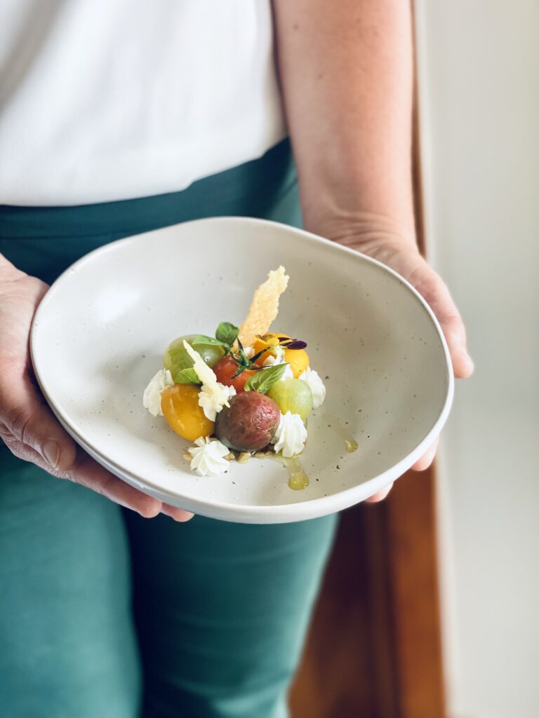 Waitress holding plate of food